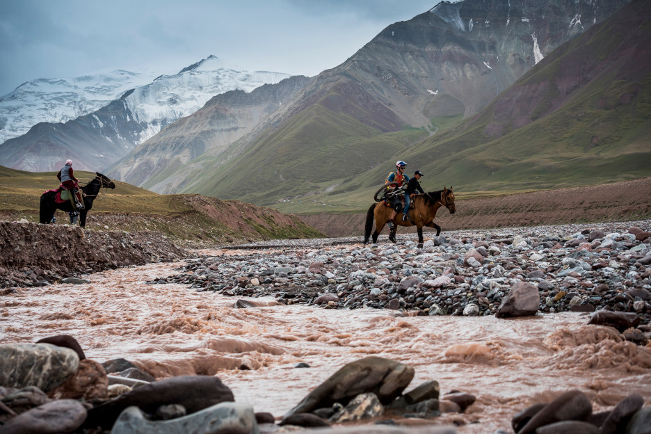 Local knowledge is gold when riding in remote locales, as is accepting an offer of help to cross glacial rivers in Kyrgyzstan.